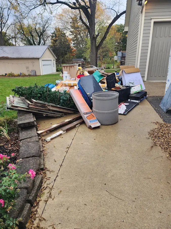 Dumpster being loaded with debris for Commercial Dumpster Rental in Plantation